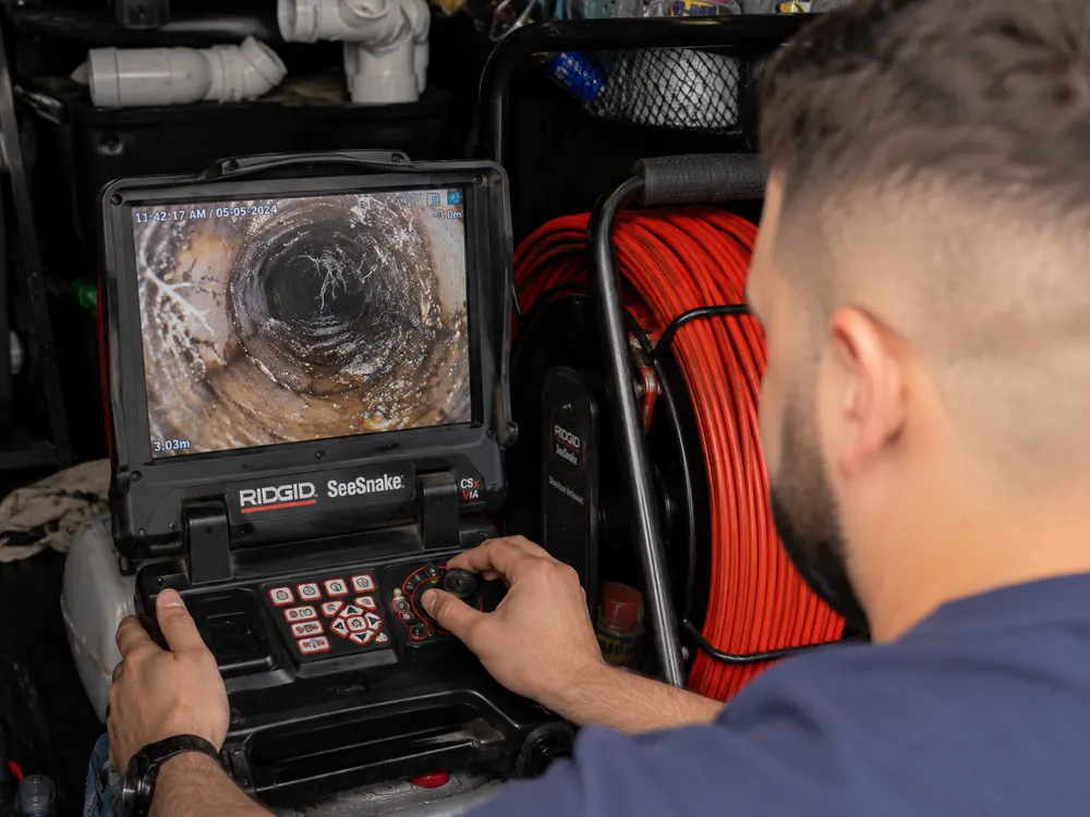 CCTV drain camera monitoring a pipe inspection